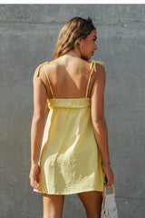 CAMI DRESS WITH ADJUSTABLE TIE STRAPS AND BOW FRONT DETAIL