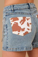 COW PRINT POCKET DENIM SHORTS WITH RHINESTONE DETAIL