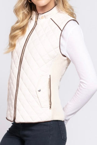 QUILTED VEST WITH SUEDE PIPING DETAIL