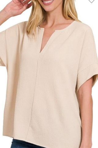 SHORT SLEEVE SPLIT NECK WOVEN TOP WITH CUFF DETAIL