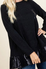 LONG SLEEVE SWEATER WITH SEQUIN POCKET AND RUFFLE HEM